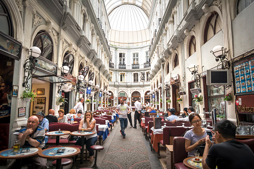 Istanbul, Turkey - June 11, 2015: Interior shot from Cicek Pasaji (Flower Passage) a famous historic passage with  historic cafes, winehouses and restaurants, situated on Istiklal Avenue, Beyoglu.