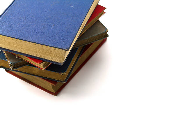 istock Stack of old antique books Isolated on white background. 477112185