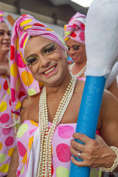 Street Carnival in Rio Rio de Janeiro, Brazil - March 1, 2014: Man holding a cotton swab is photographed few minutes before Ipanema Band 50th Parade nudie suit stock pictures, royalty-free photos & images