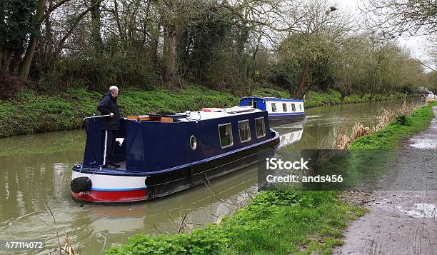 Man Driving Narrow Boat On Canal Stock Photo - Download Image Now - 2015, Barge, Canal