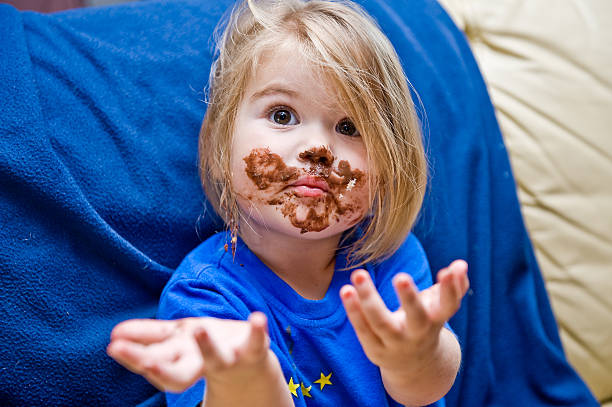 Girl is eating girl is eating, girl, eat, chocolate, meal, horizontal chocolate fingers stock pictures, royalty-free photos & images