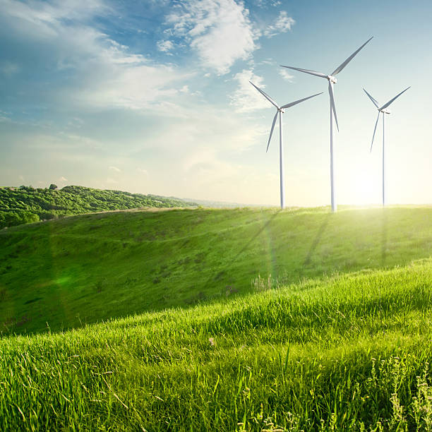 wind generator turbine auf sommer landschaft - factory green industry landscape stock-fotos und bilder