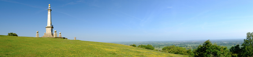 Coombe Hill, UK - June 11, 2015: A panorama of Coombe Hill in the Chiltern Hills, Buckinghamshire. The Memorial to the Boer War looks out over the Vale of Aylesbury and the proposed route of HS2, the controversial high-speed rail link between London and Birmingham.