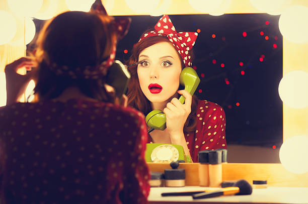 istock woman with dial phone applying cosmetics 477118000