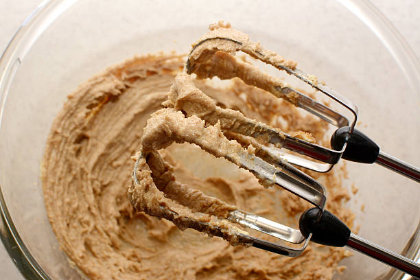 istock Creaming sugar and butter together with a hand mixer 477122235