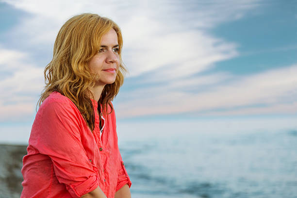istock Woman on a beach 477124762