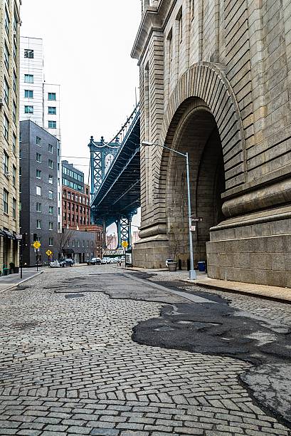 istock Cobble stone street in Brooklyn under Manhattan Bridge 477125694