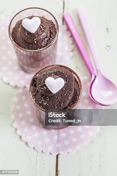 Dark Chocolate Mousse In Glasses Garnished With Heart Candies Stock Photo - Download Image Now