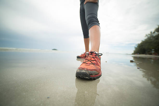 istock Woman training on the beach 477126026