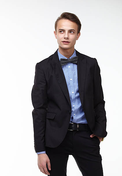 istock young handsome man in elegant suit with butterfly 477126082