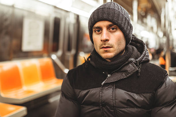 istock caucasian serious pensive man with knit hat on the metro 477126623