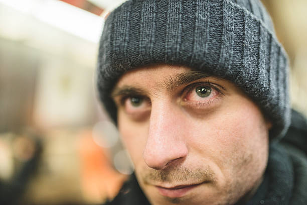 istock caucasian serious pensive man with knit hat on the metro 477129759