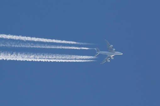 Plane at cruising altitude against blue sky