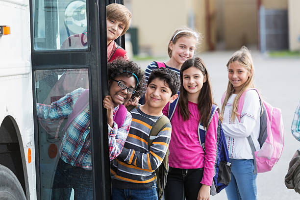 istock Children getting on school bus 477130317