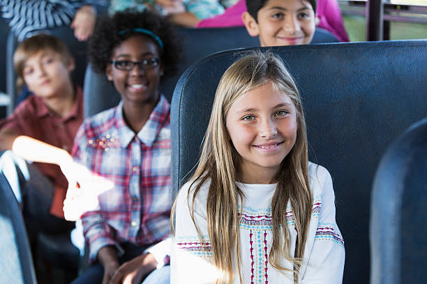 istock Children riding school bus 477130335