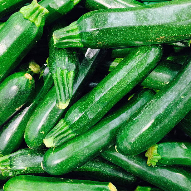 istock Courgettes (zucchine), background of stacked vegetables 477134710