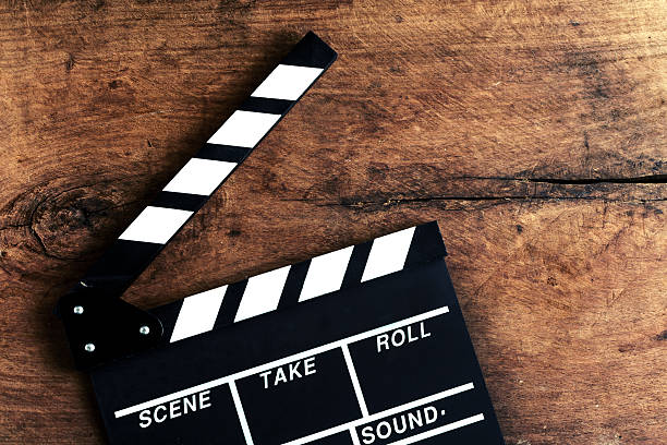 istock Movie clapper on old wooden background 477135704