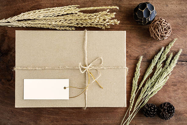 istock Brown paper box on old wood background with dried flower 477135710