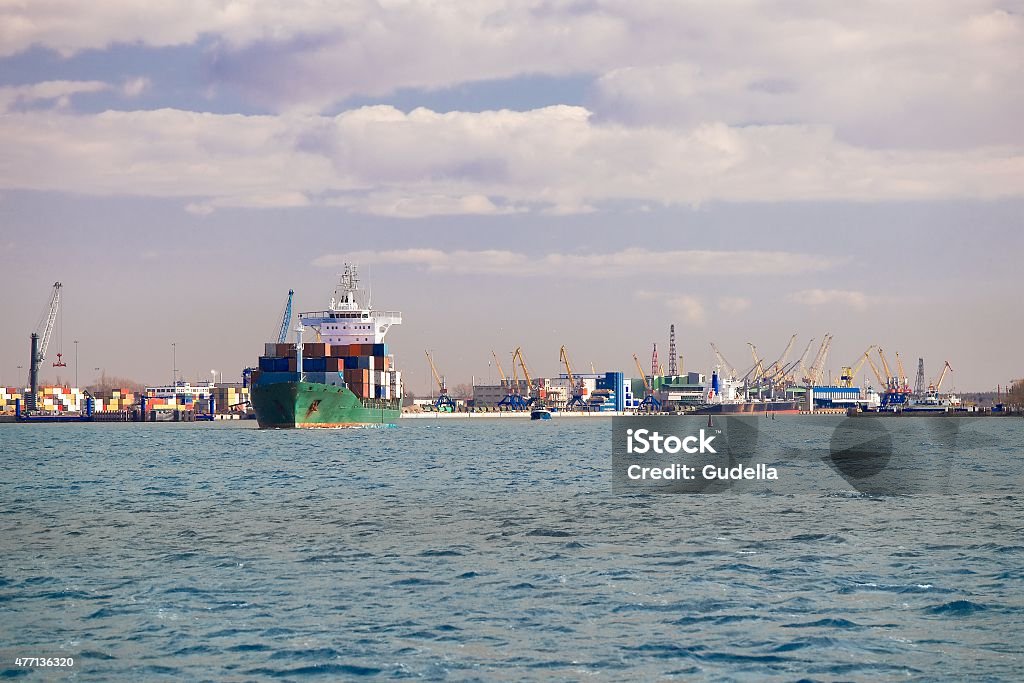 Industrial dock Industrial dock with cranes and container ship 2015 Stock Photo