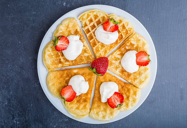 istock Waffles with strawberry and whipped cream 477139236