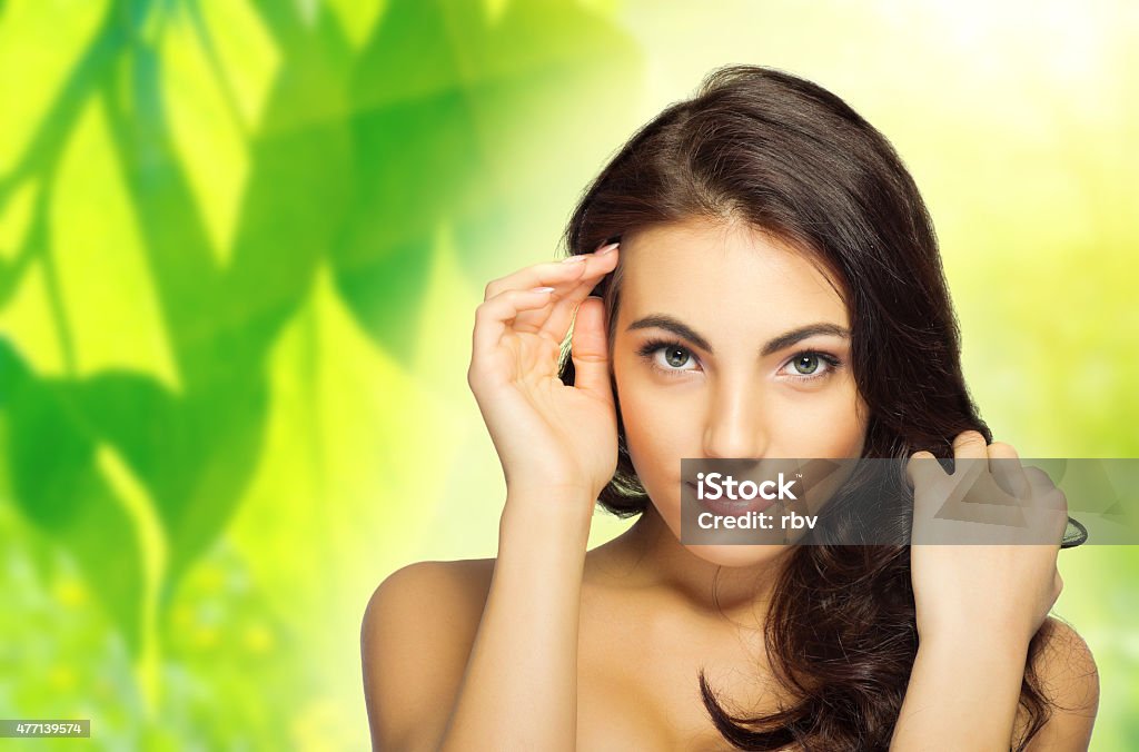 Young woman on floral background Young healthy woman on floral background 2015 Stock Photo