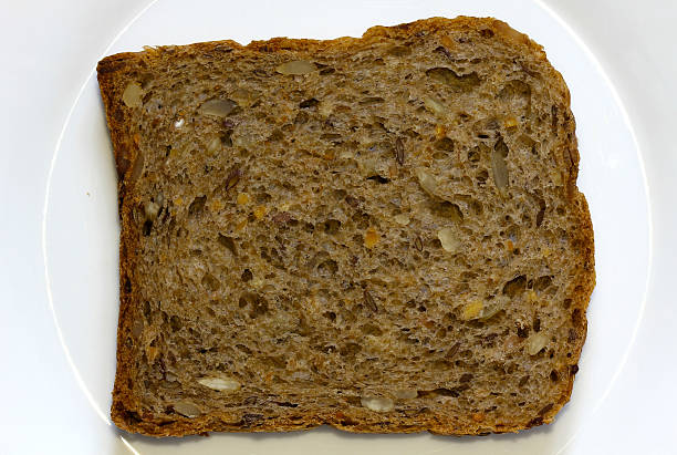 kawałek chleb - loaf of bread bread portion 7 grain bread zdjęcia i obrazy z banku zdjęć