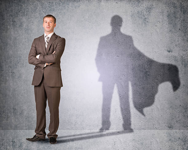 istock Businessman with shadow in cape 477145590