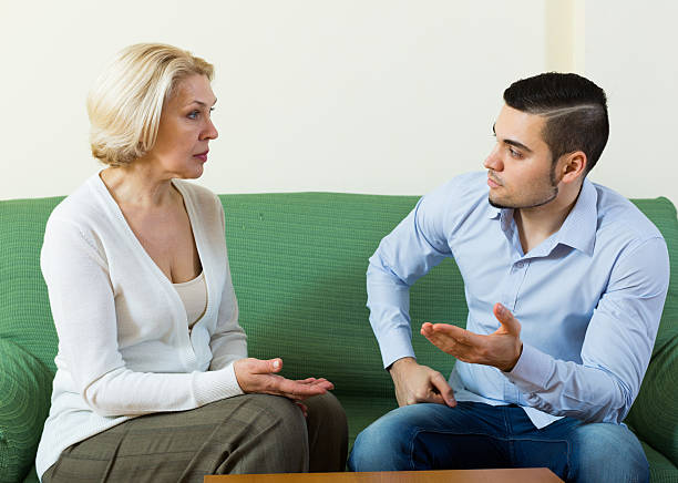 istock Difficulties of communication between son and mother 477148104