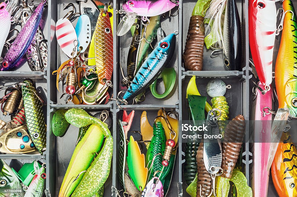 fishing lures and accessories in the box fishing lures and accessories in the box background Fishing Tackle Stock Photo