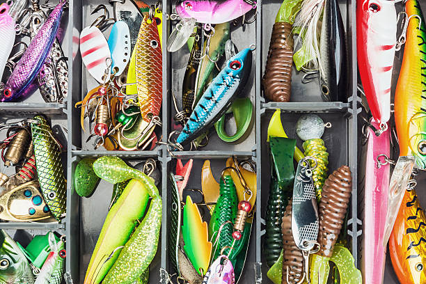 fishing lures and accessories in the box fishing lures and accessories in the box background fishing tackle stock pictures, royalty-free photos & images
