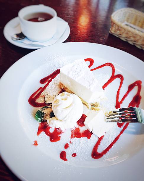 Tasty cheesecake with strawberry jam and icecream