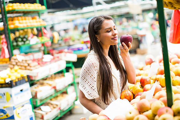 istock Young woman on the market 477151076