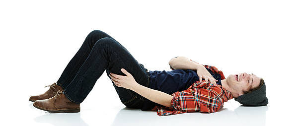 istock Cheerful hipster lying down and laughing out 477154292