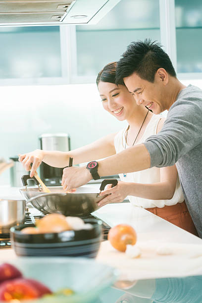 istock Young Chinese Couple in Kitchen 477154832