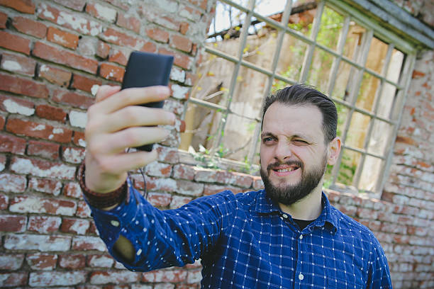 istock Young hipster man taking a selfie 477155090