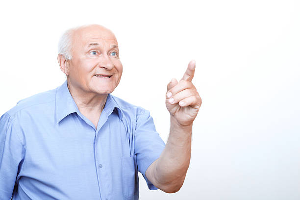istock Inspired grandfather pointing with index finger 477158156