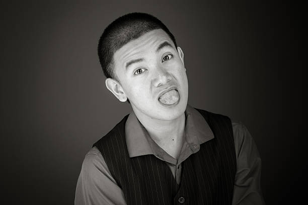 istock model isolated on plain background face sticking tongue out 477159662