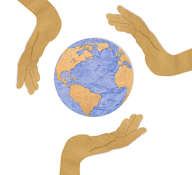 istock recycled paper cut of three hand hold earth 477161787