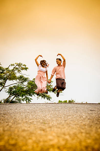 istock Lovely couple jump on the bridge 477161809