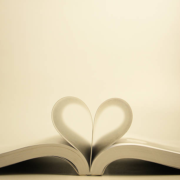 istock Opened book with heart page 477163560