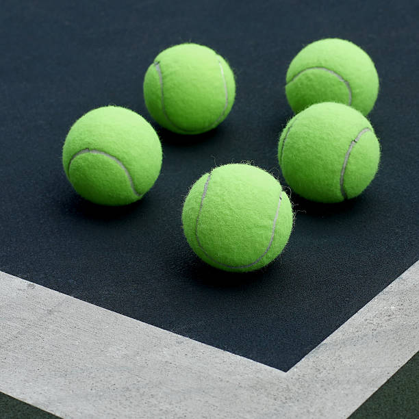 istock tennis ball  on court  background 477163608