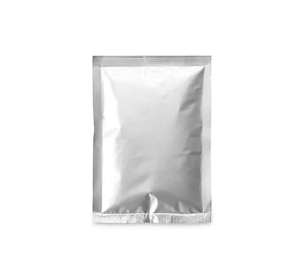 Aluminum bag containing chemicals isolated on white background.