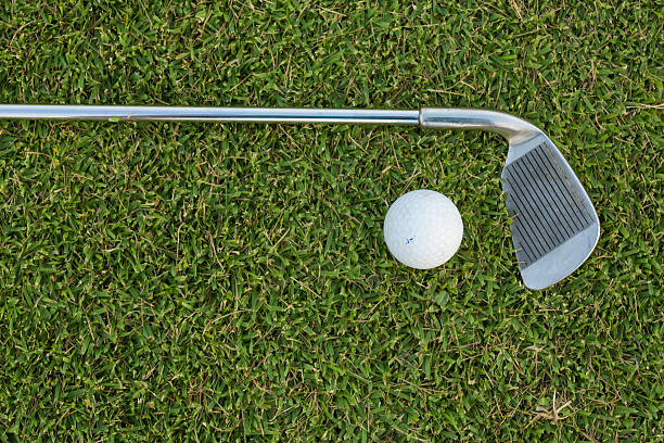 istock Golf Ball and Golf Club on grass 477169654