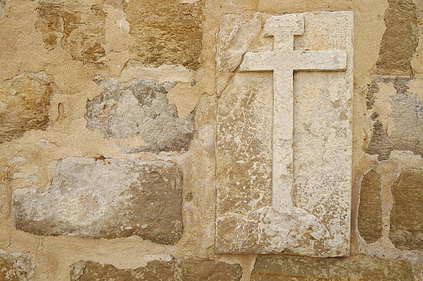 istock Cross on wall of a medieval church 477173466