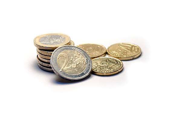 Euro Currency Coins Pile 1 Euro, 2 Euro & 20 Euro Cents currency coins isolated on white background. european union coin photos stock pictures, royalty-free photos & images