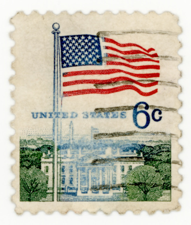 UNITED STATES OF AMERICA A vintage stamp printed in the USA shows flag over capitol