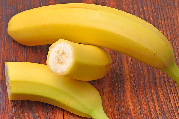 istock Bananas on wooden background 477177348