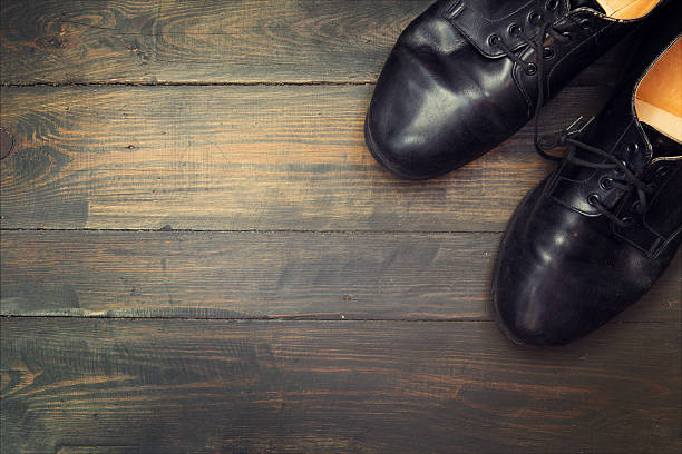 istock Black shoes on the wooden background 477177404