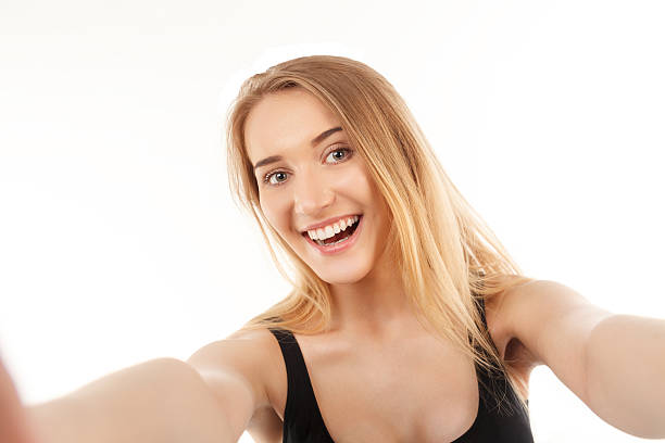 istock young pretty blonde women taking selfie 477181172