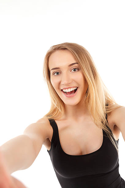 istock young pretty blonde women taking selfie 477181174